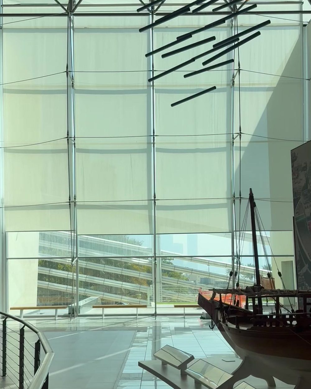 Full-height motorised shading on a glazed atrium facade