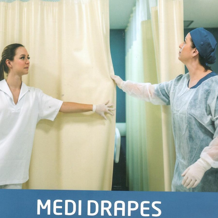 Cubicle curtain on ceiling track being drawn in a clinical room